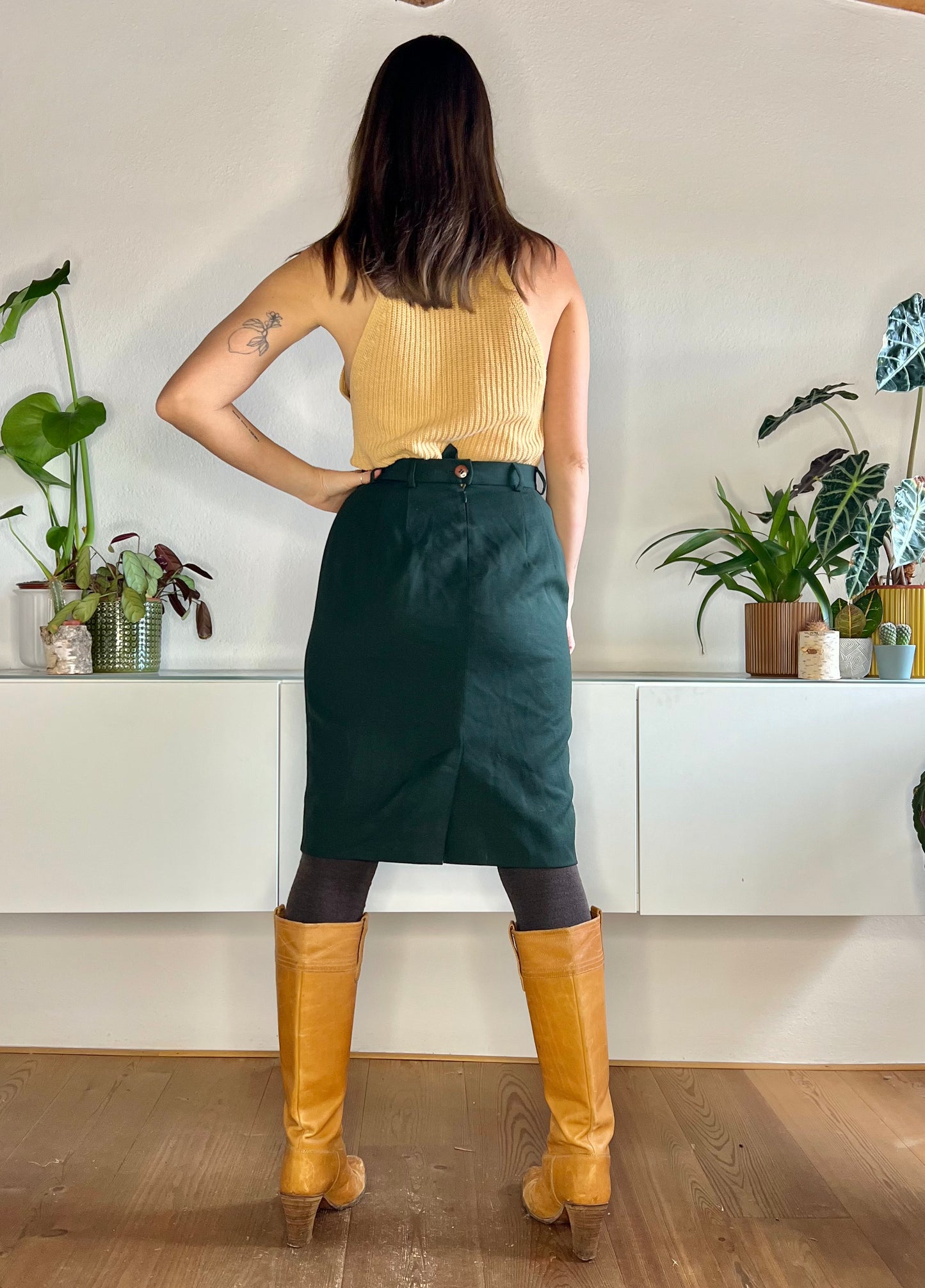1970's vintage dark green wool midi skirt with asymmetrical pleat detail