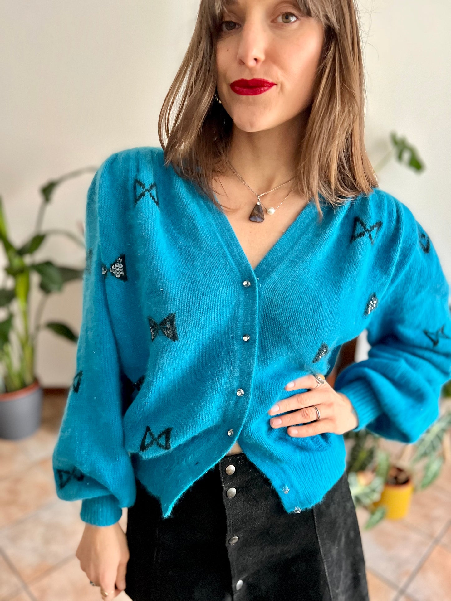 1960's vintage turquoise angora cardigan with black bow details