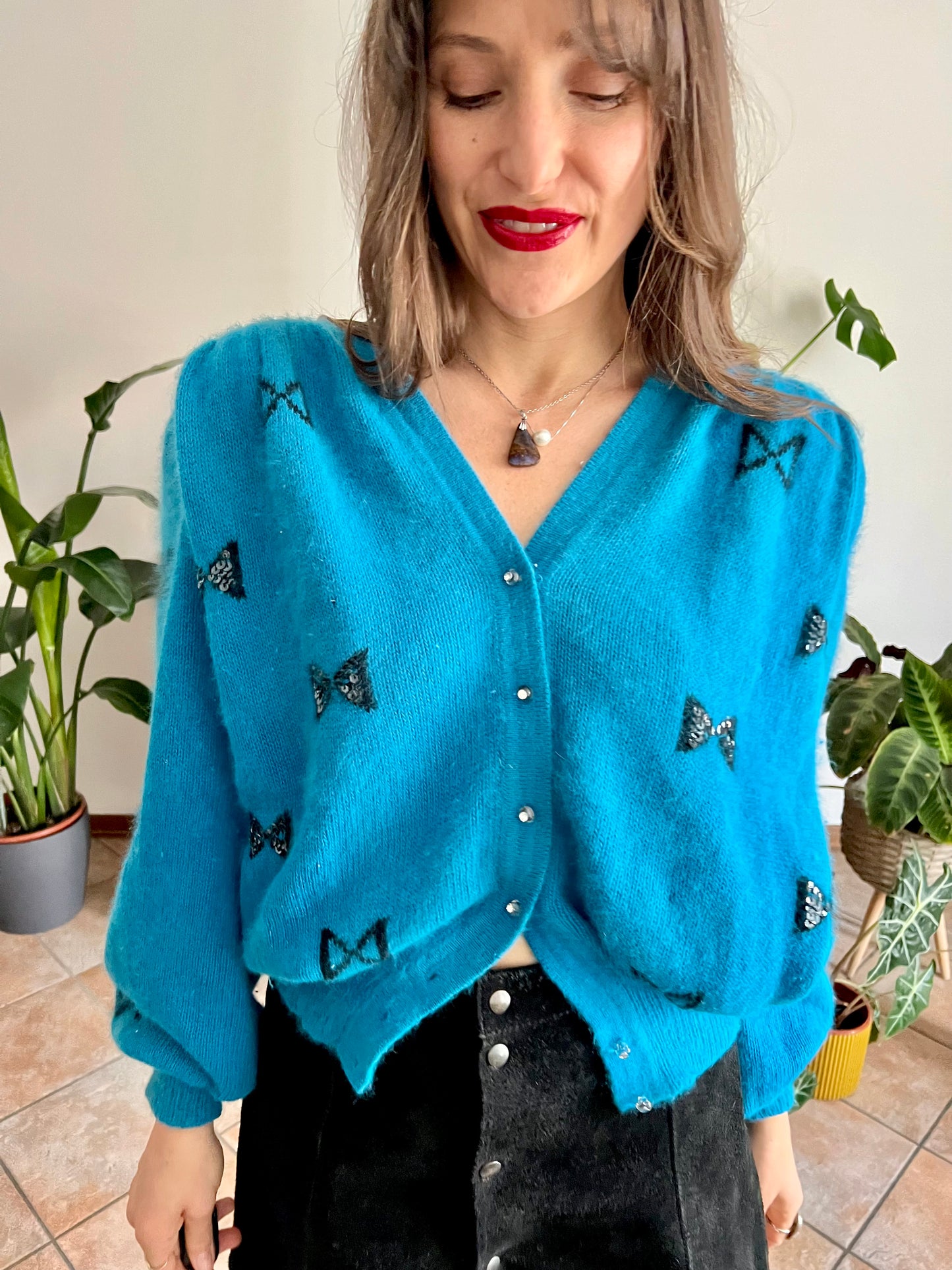 1960's vintage turquoise angora cardigan with black bow details