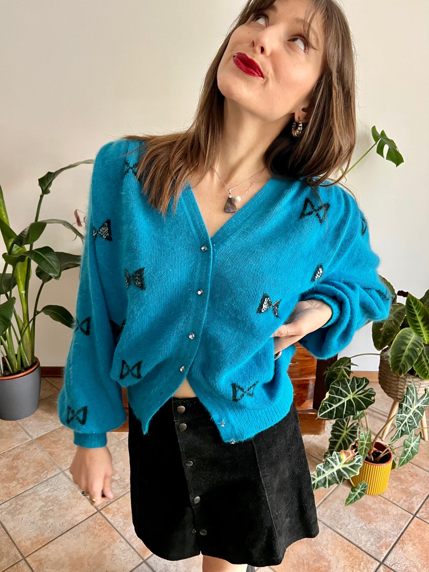 1960's vintage turquoise angora cardigan with black bow details