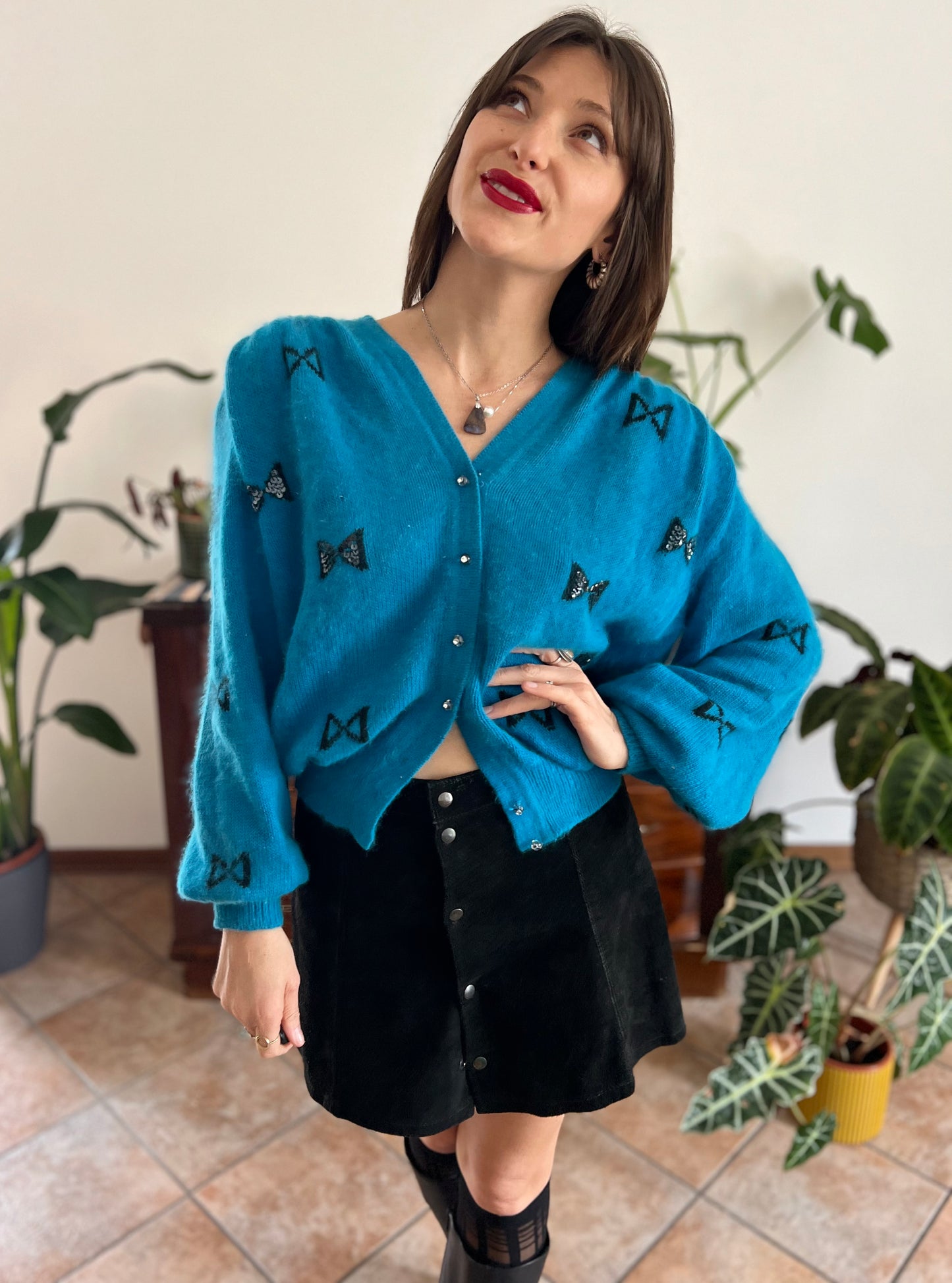 1960's vintage turquoise angora cardigan with black bow details