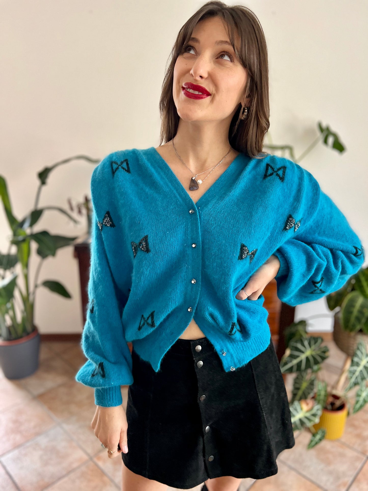 1960's vintage turquoise angora cardigan with black bow details