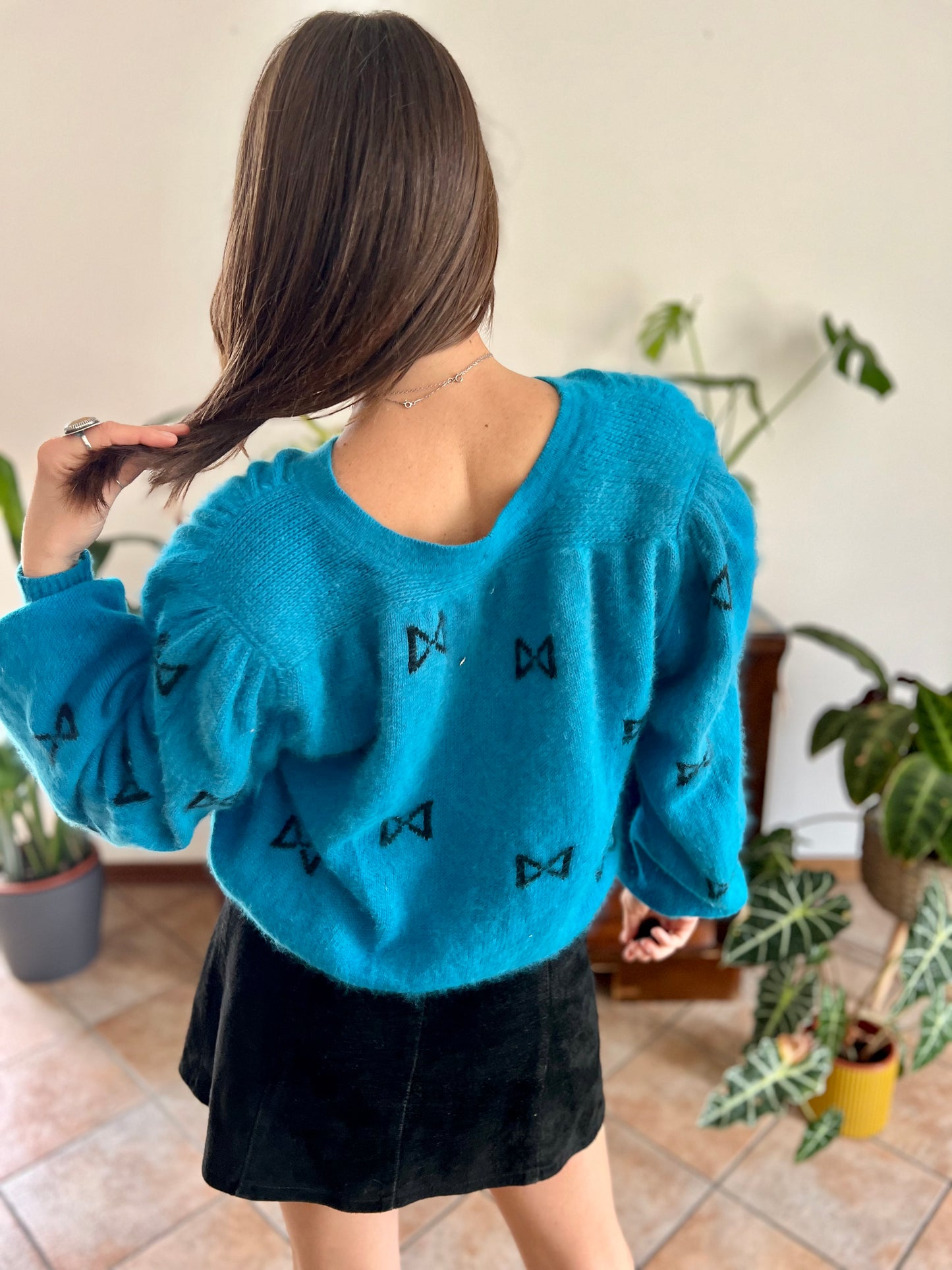 1960's vintage turquoise angora cardigan with black bow details