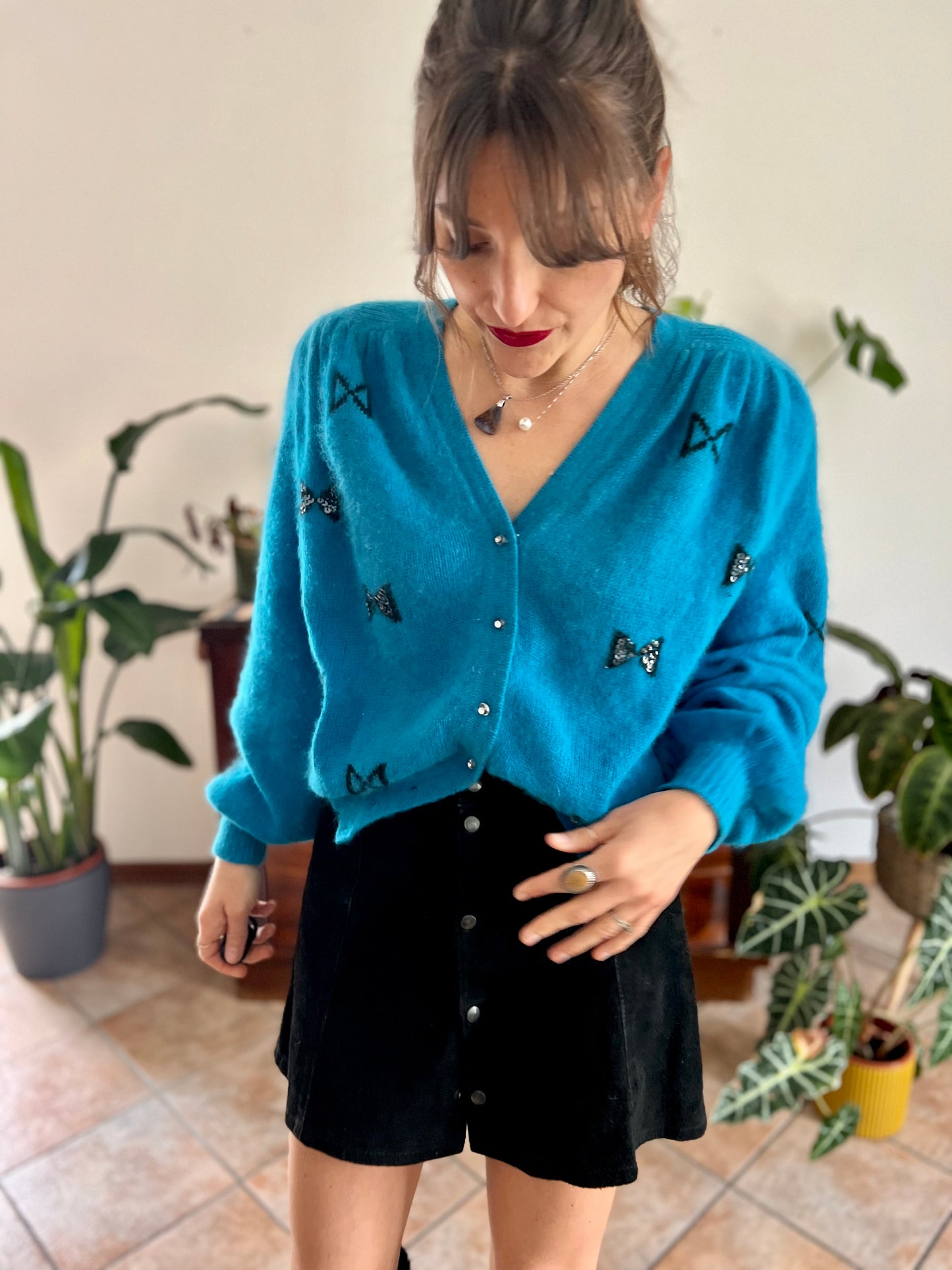 1960's vintage turquoise angora cardigan with black bow details