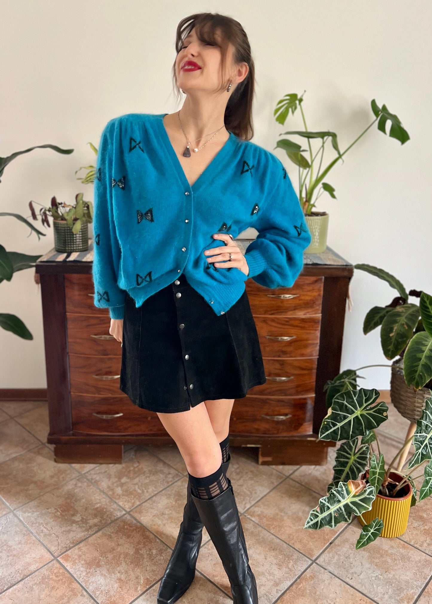 1960's vintage turquoise angora cardigan with black bow details