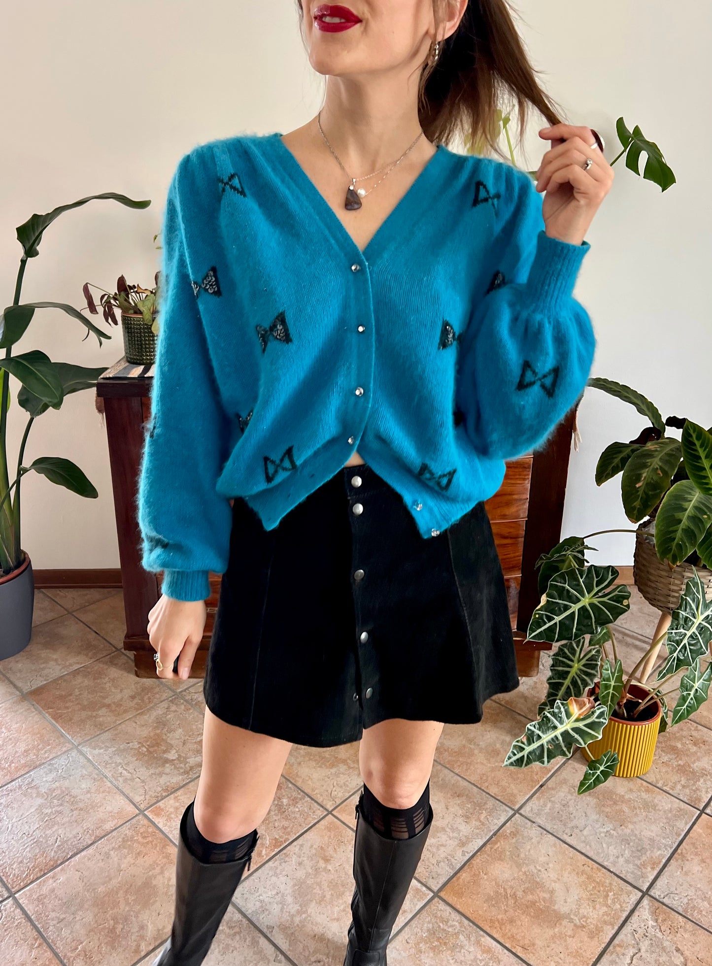 1960's vintage turquoise angora cardigan with black bow details