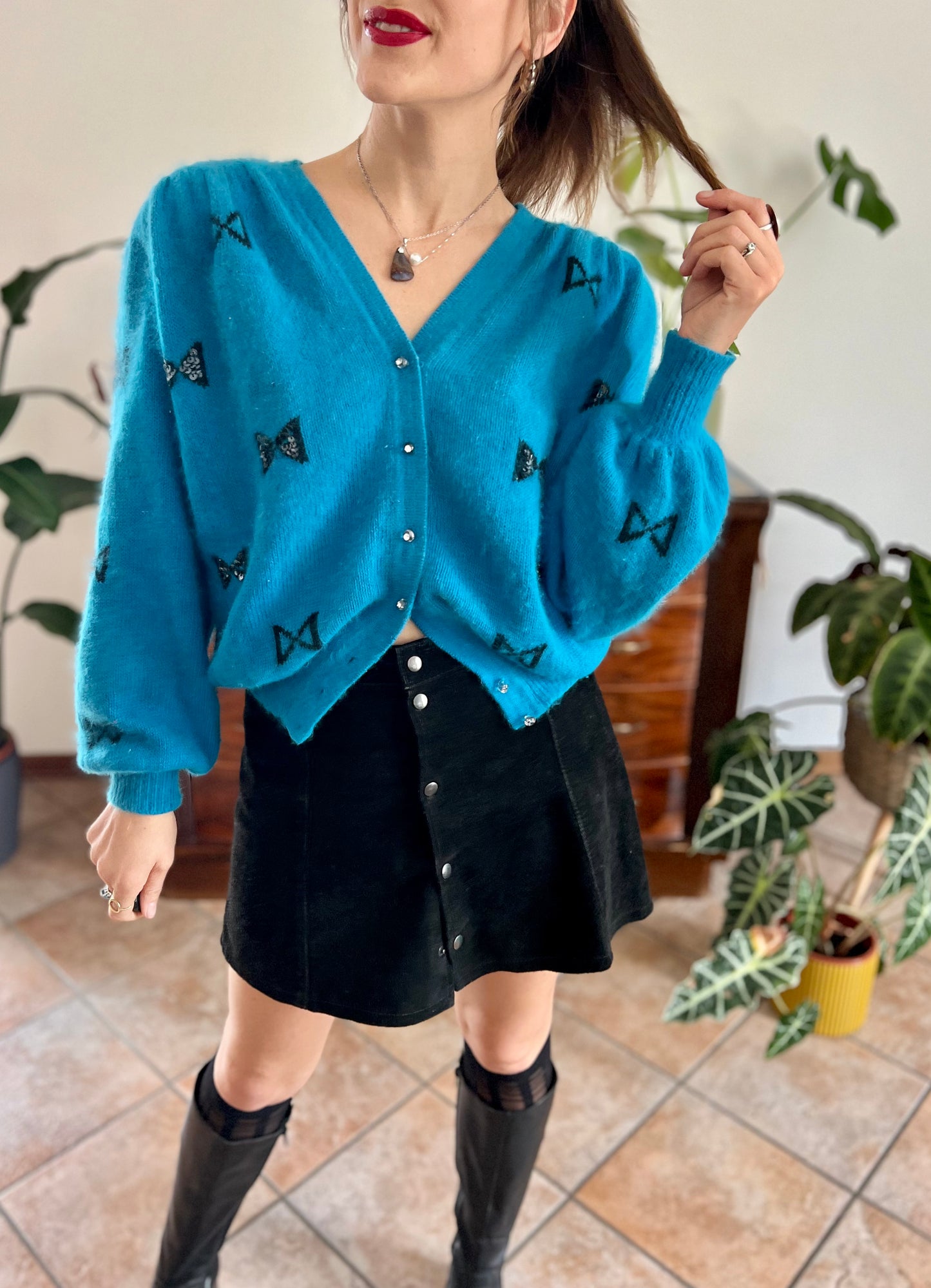 1960's vintage turquoise angora cardigan with black bow details
