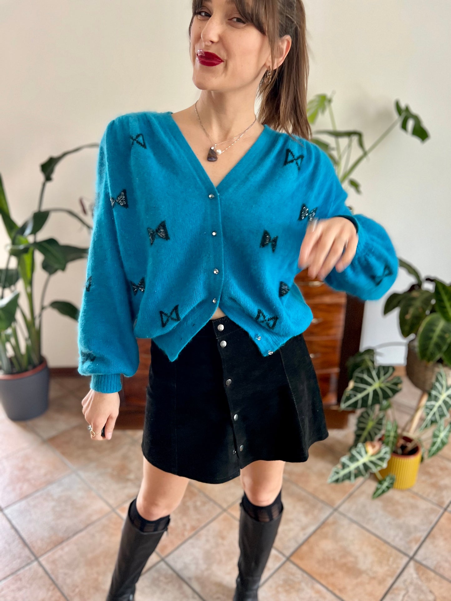 1960's vintage turquoise angora cardigan with black bow details