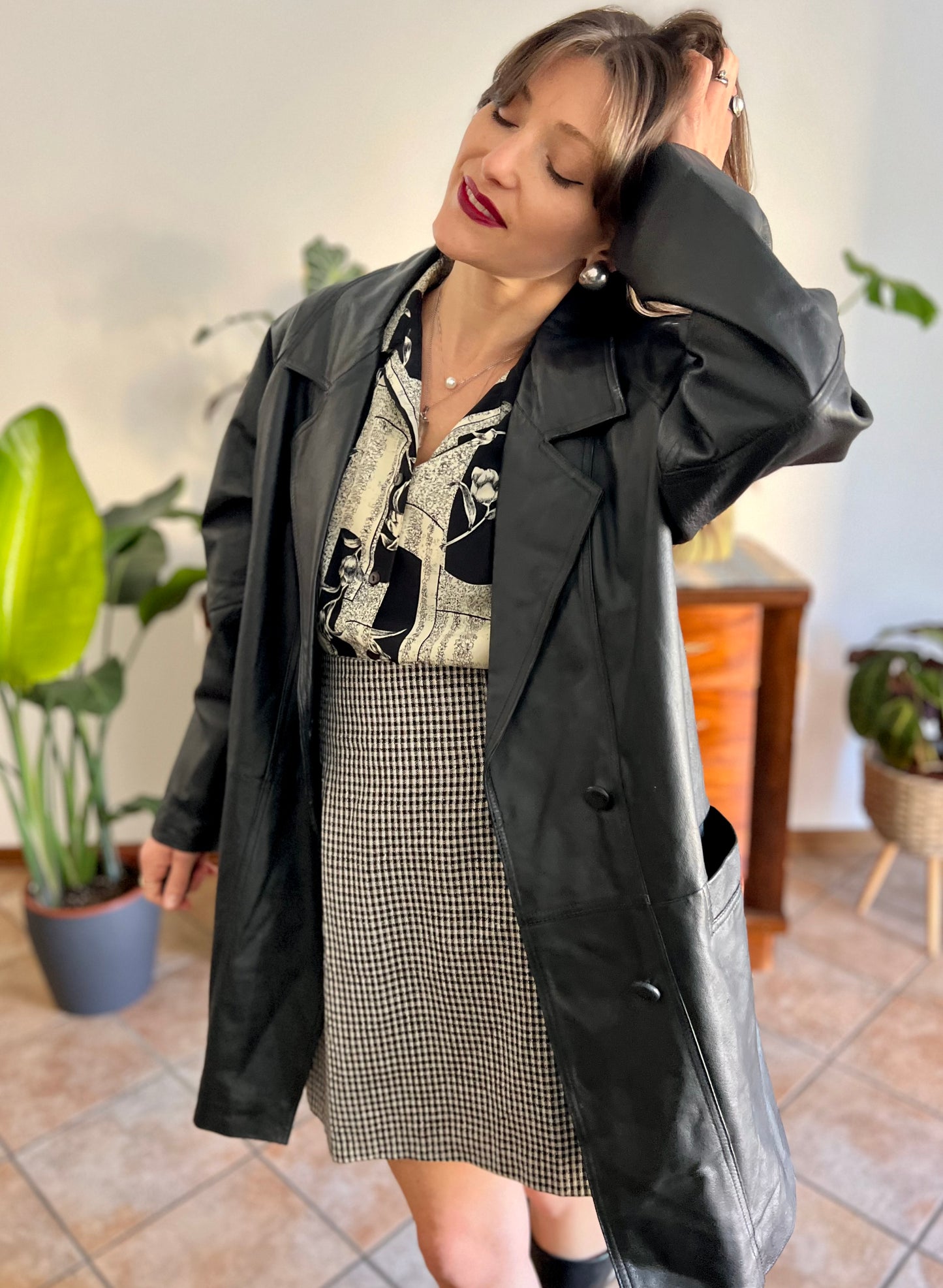 1980's vintage oversize black leather jacket with asymmetrical buttons