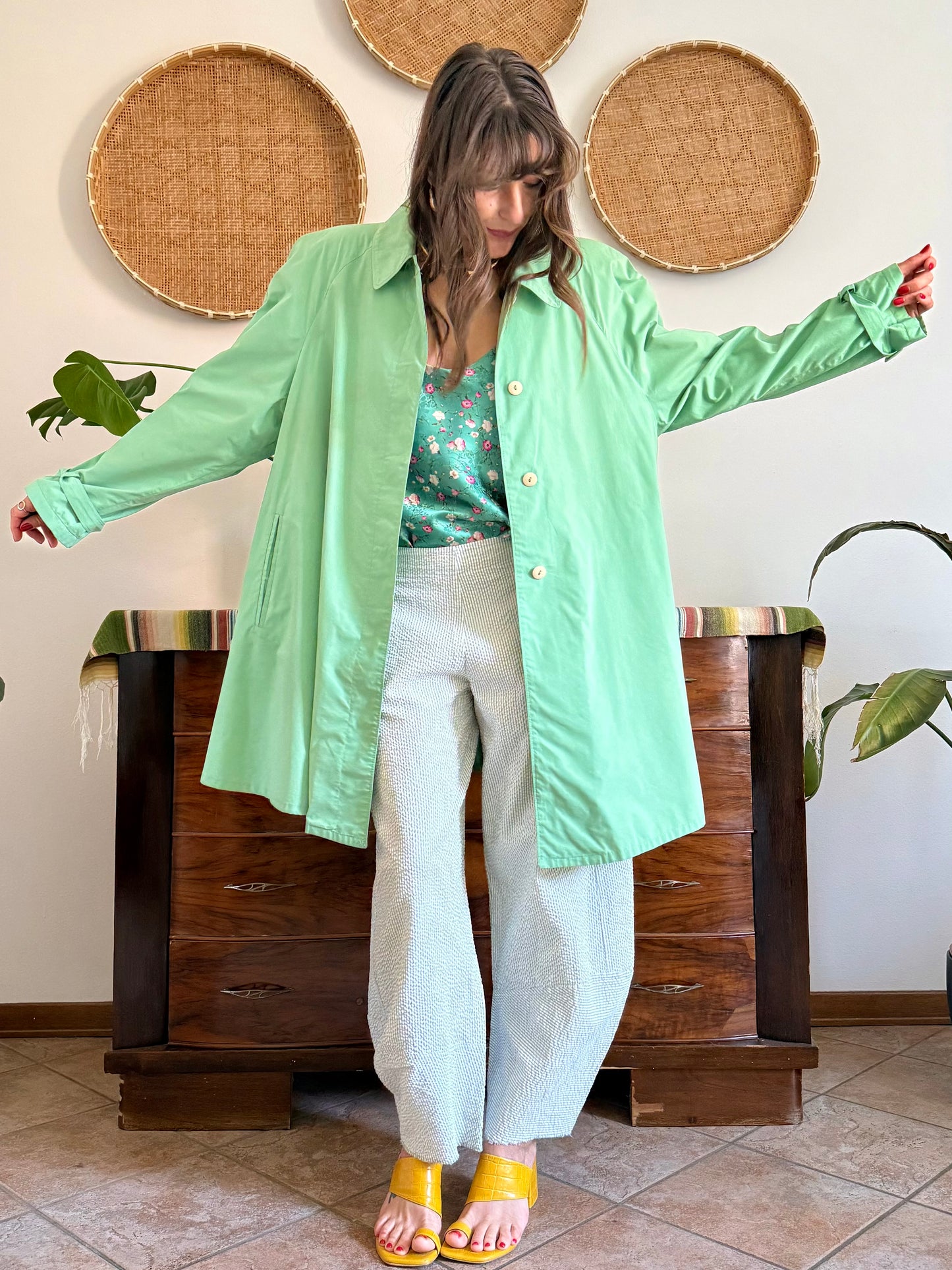 1999’s vintage green trench coat with blue and white polkadot lining