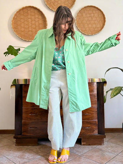 1999’s vintage green trench coat with blue and white polkadot lining
