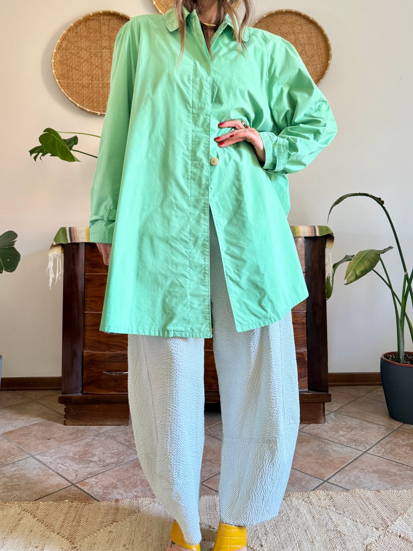 1999’s vintage green trench coat with blue and white polkadot lining