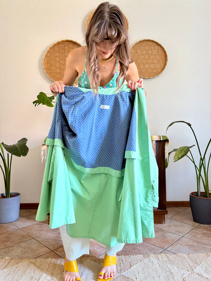 1999’s vintage green trench coat with blue and white polkadot lining