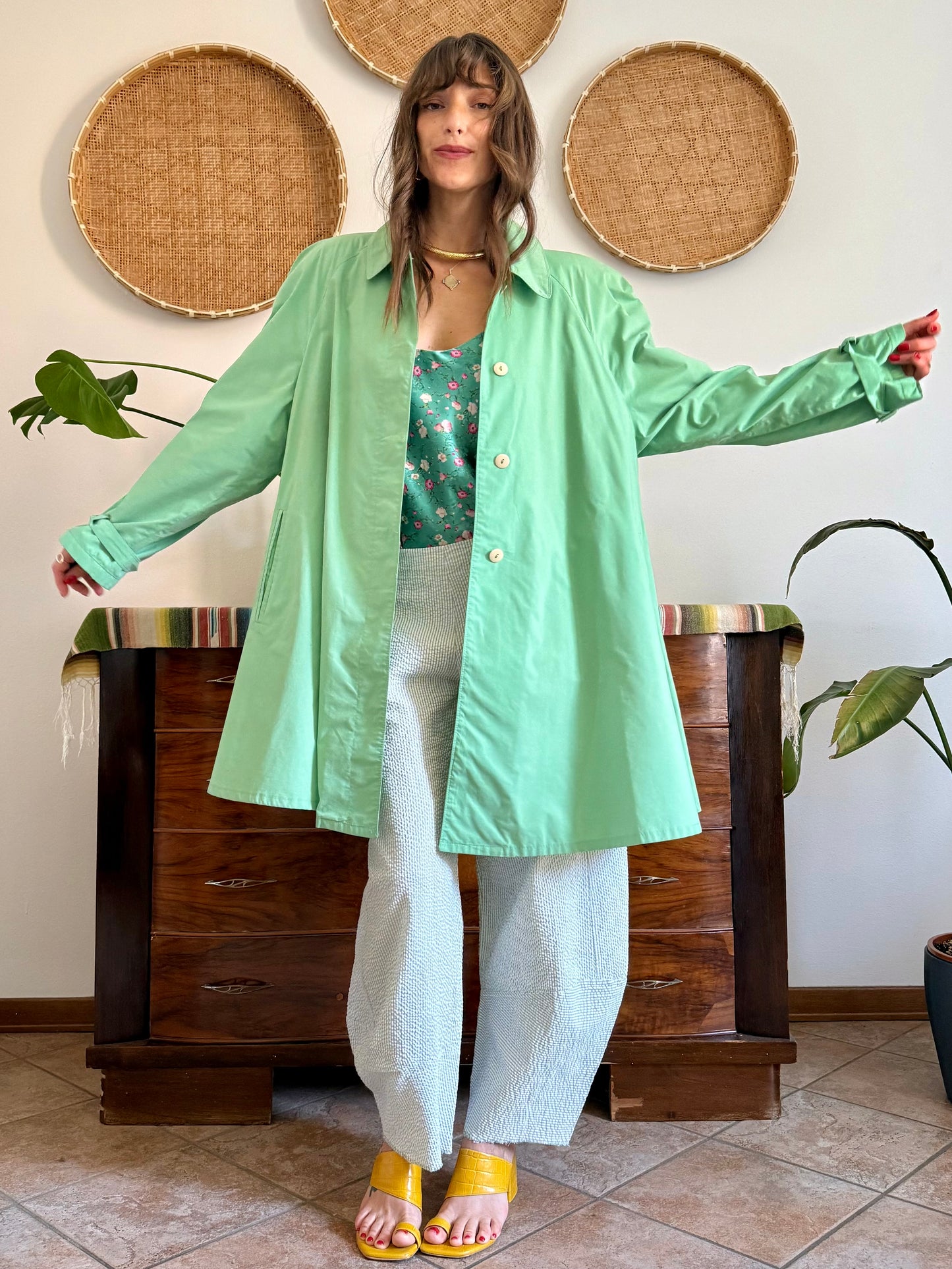 1999’s vintage green trench coat with blue and white polkadot lining