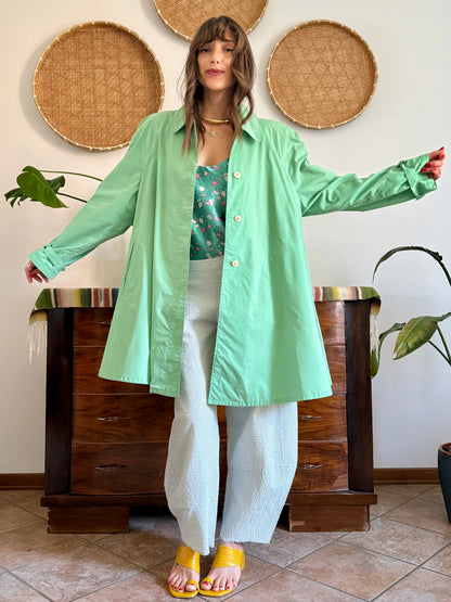 1999’s vintage green trench coat with blue and white polkadot lining