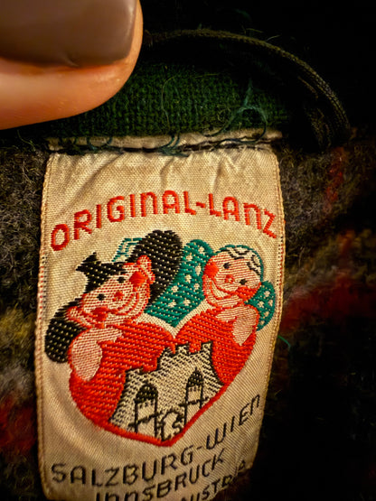 1950's vintage charcoal grey tyrol coat with green trimming and red and green plaid wool lining