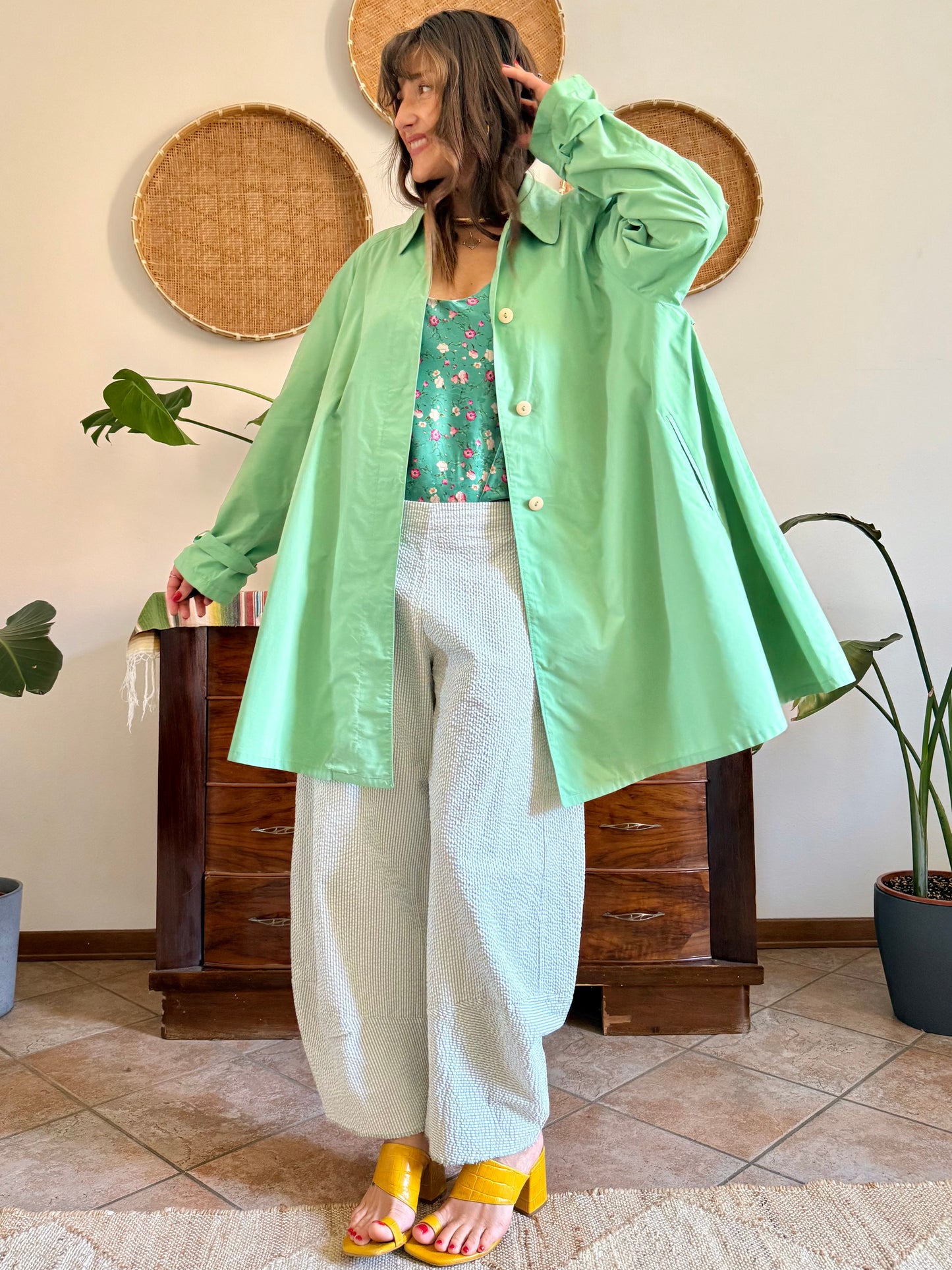 1999’s vintage green trench coat with blue and white polkadot lining