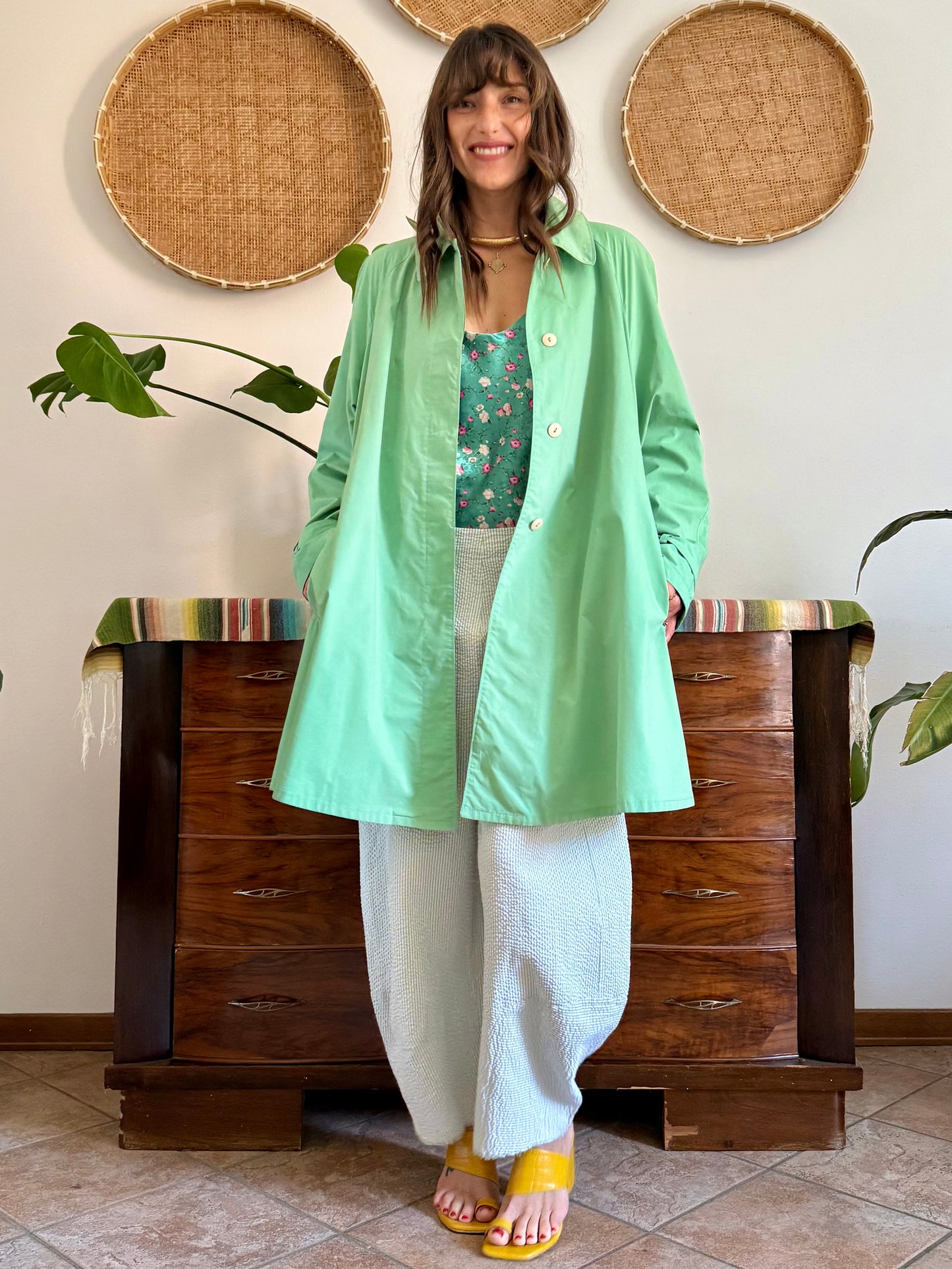 1999’s vintage green trench coat with blue and white polkadot lining