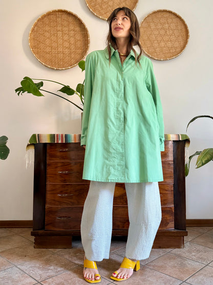 1999’s vintage green trench coat with blue and white polkadot lining