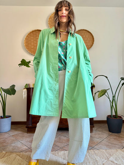 1999’s vintage green trench coat with blue and white polkadot lining