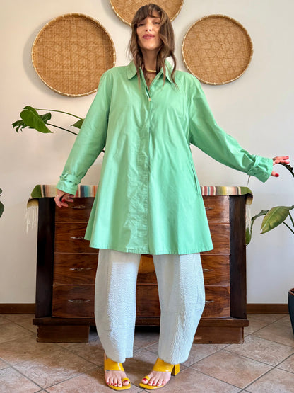 1999’s vintage green trench coat with blue and white polkadot lining