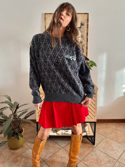 1970's grey wool pullover with blue geometric knit pattern and pocket detail