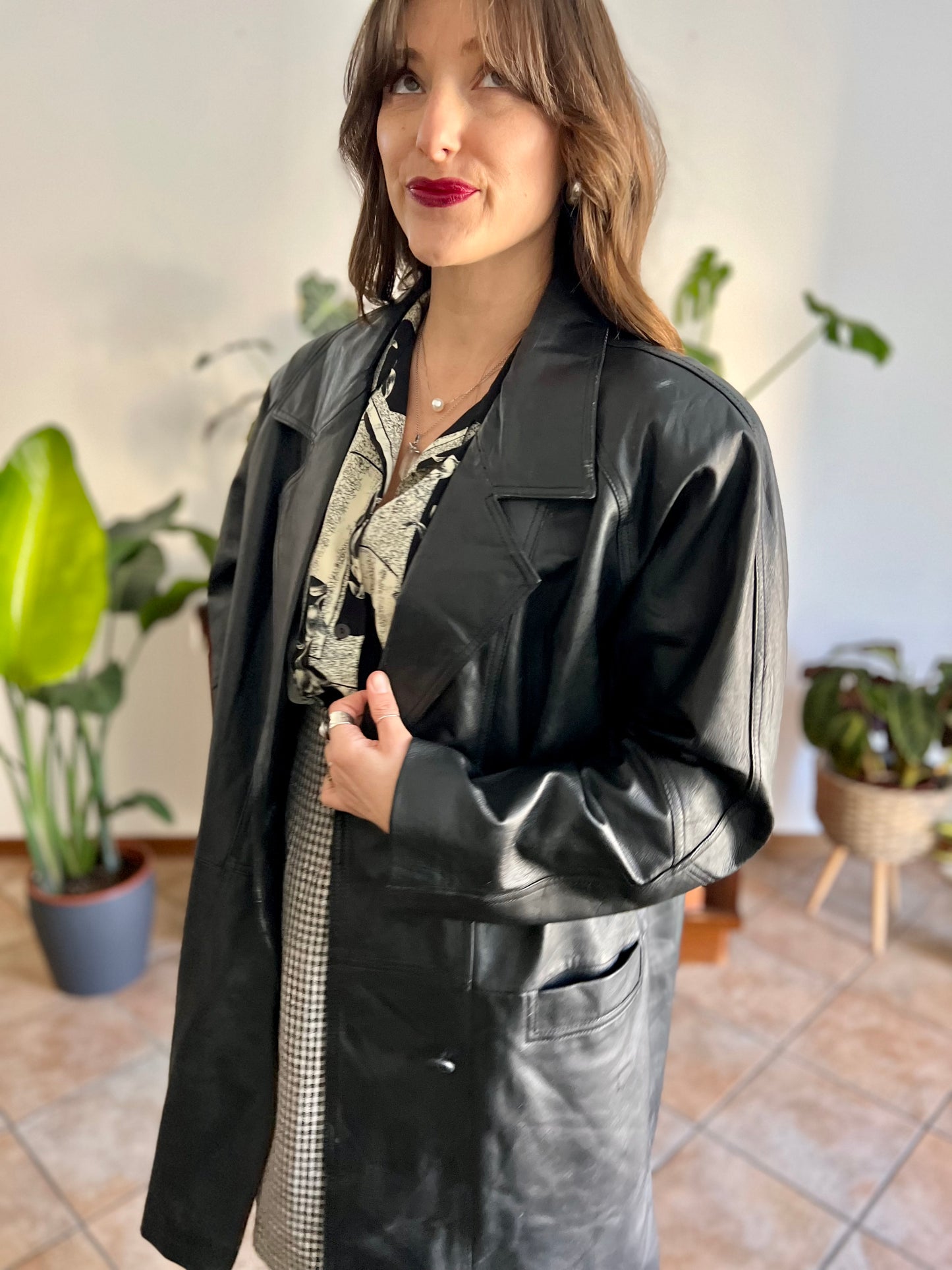 1980's vintage oversize black leather jacket with asymmetrical buttons