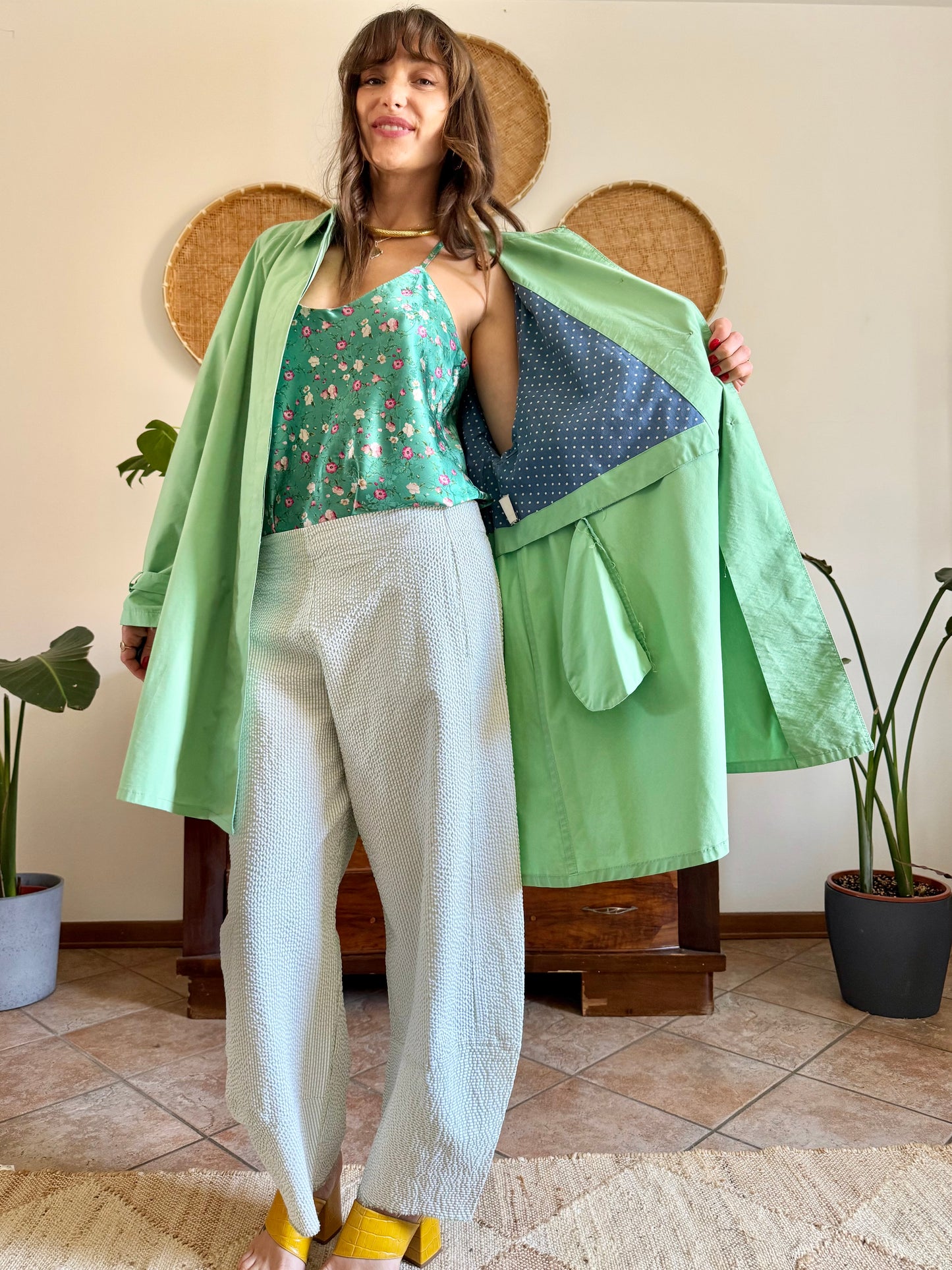 1999’s vintage green trench coat with blue and white polkadot lining