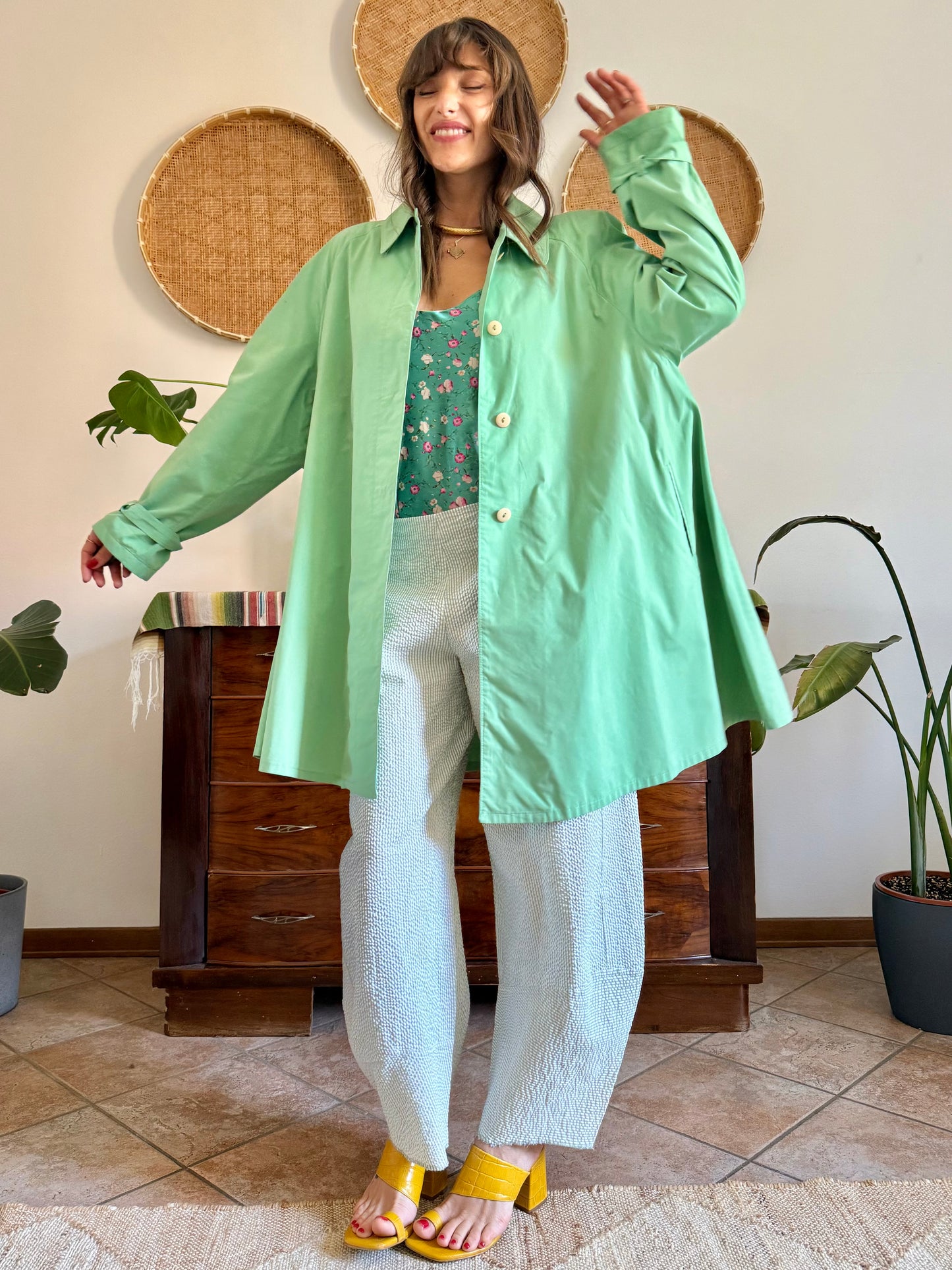 1999’s vintage green trench coat with blue and white polkadot lining