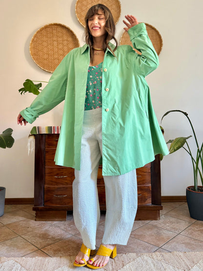 1999’s vintage green trench coat with blue and white polkadot lining