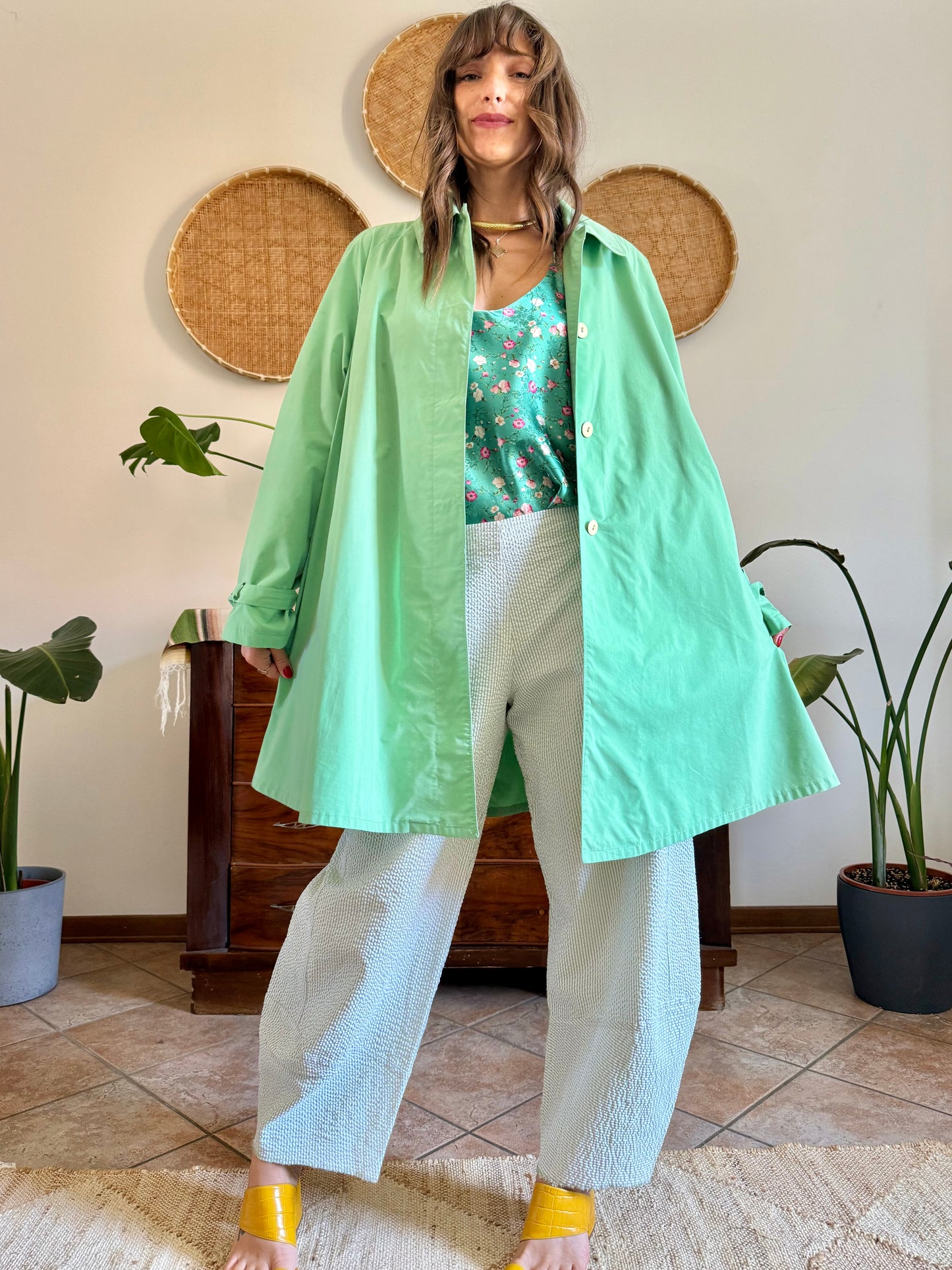 1999’s vintage green trench coat with blue and white polkadot lining
