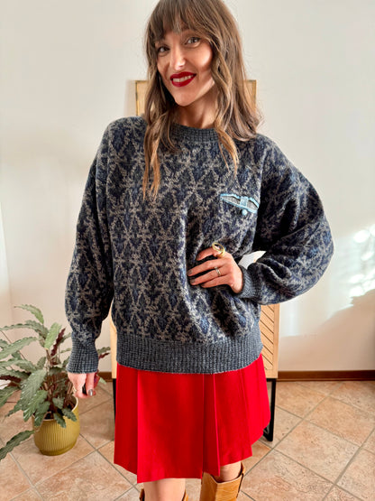 1970's grey wool pullover with blue geometric knit pattern and pocket detail