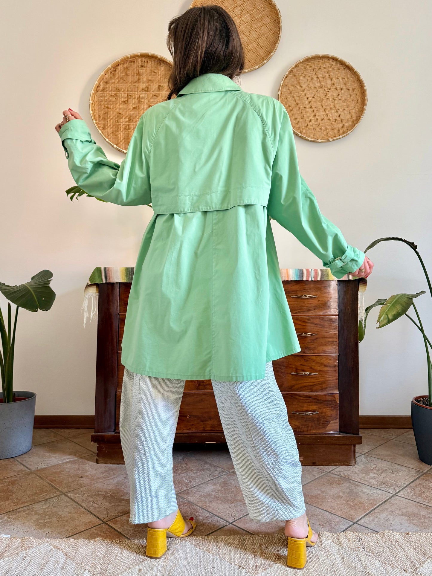 1999’s vintage green trench coat with blue and white polkadot lining