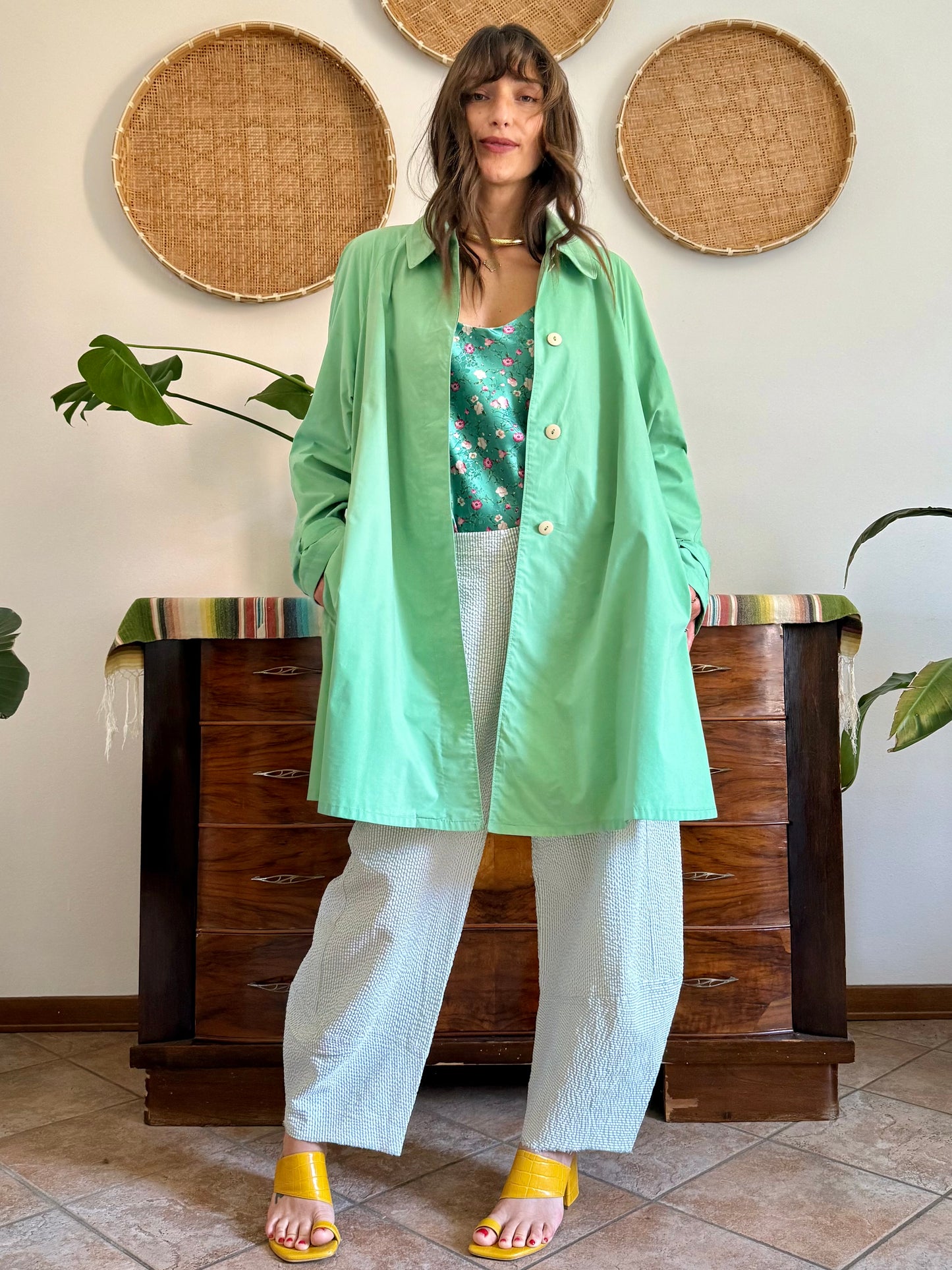 1999’s vintage green trench coat with blue and white polkadot lining