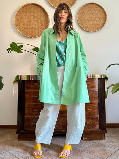 1999’s vintage green trench coat with blue and white polkadot lining