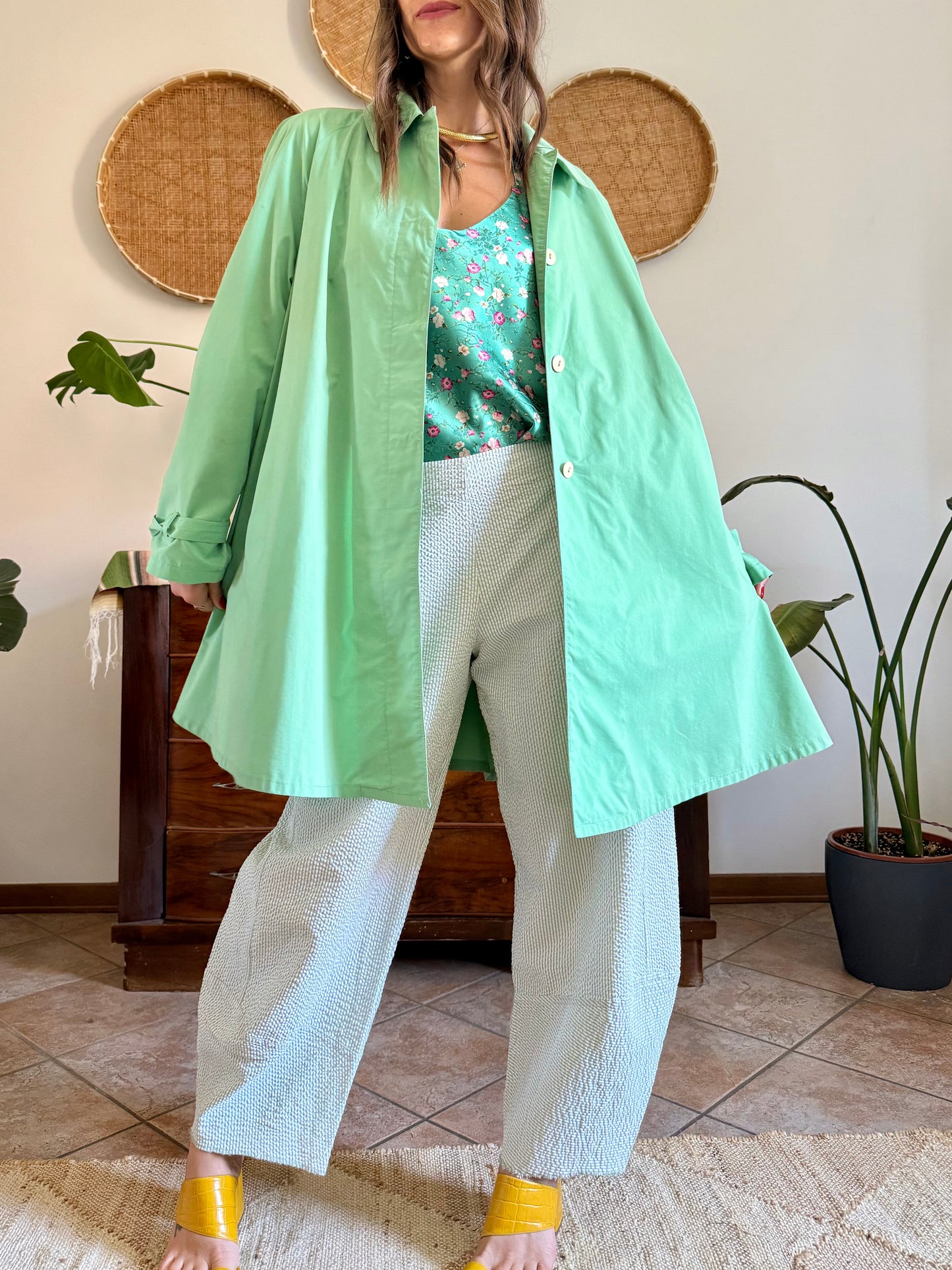 1999’s vintage green trench coat with blue and white polkadot lining