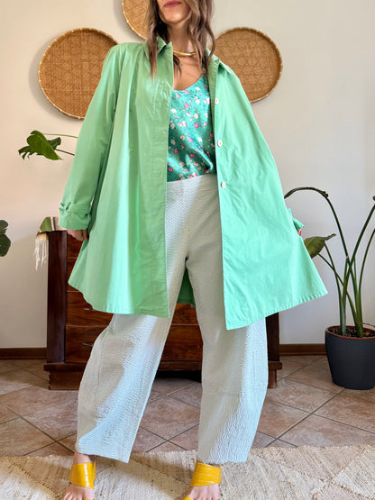 1999’s vintage green trench coat with blue and white polkadot lining
