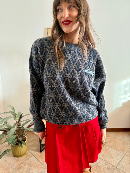 1970's grey wool pullover with blue geometric knit pattern and pocket detail