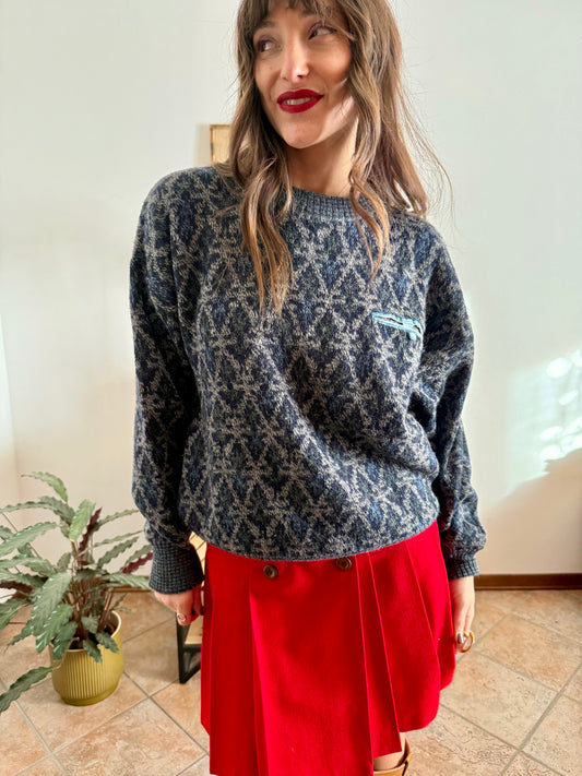 1970's grey wool pullover with blue geometric knit pattern and pocket detail
