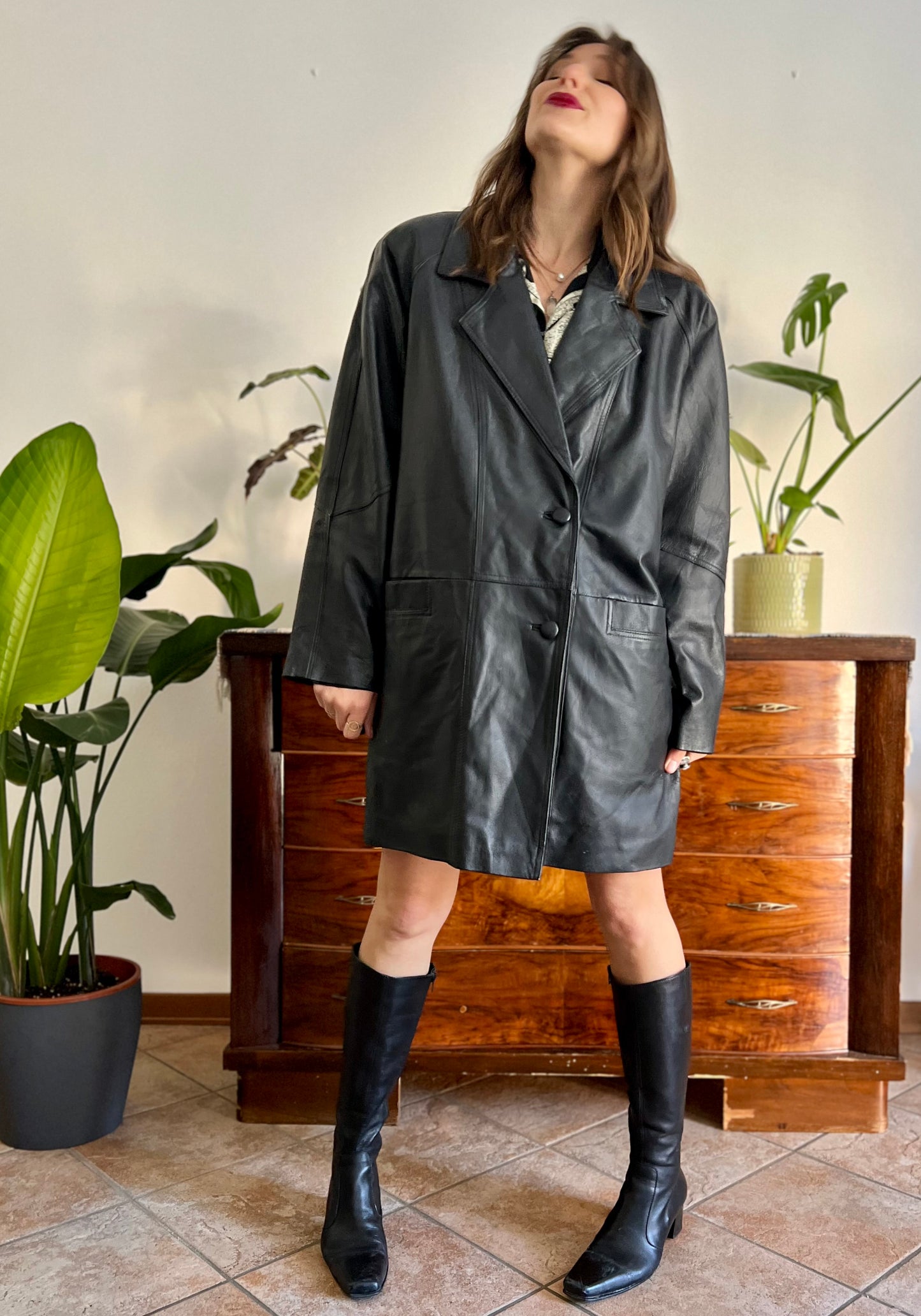 1980's vintage oversize black leather jacket with asymmetrical buttons