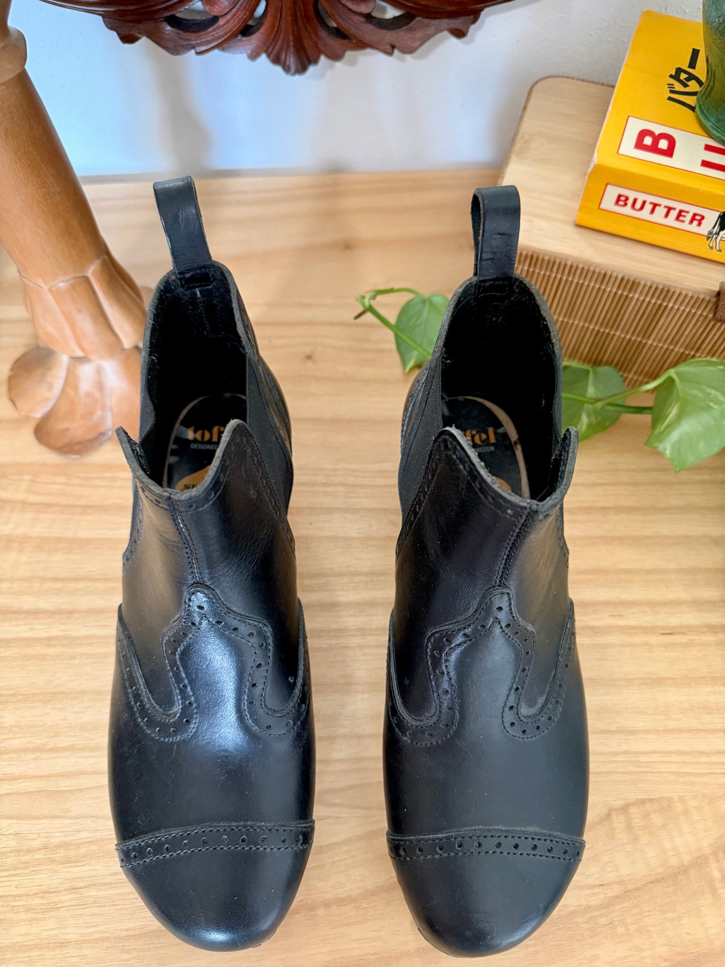 Black leather Swedish Haskbeen bottles with tooled leather detailing