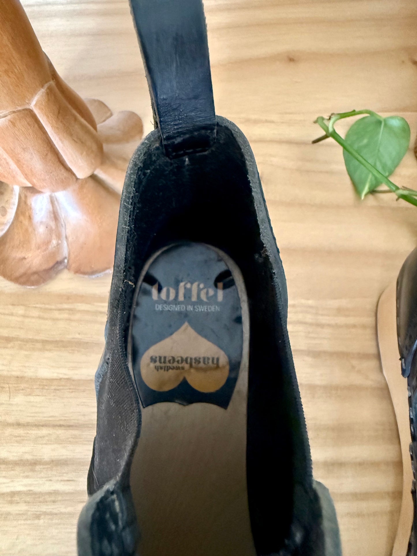 Black leather Swedish Haskbeen bottles with tooled leather detailing