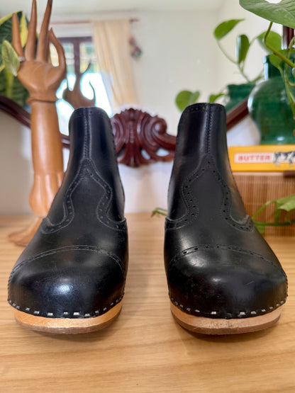 Black leather Swedish Haskbeen bottles with tooled leather detailing