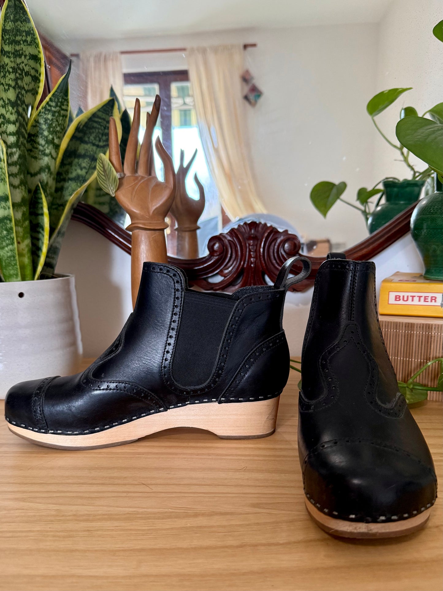 Black leather Swedish Haskbeen bottles with tooled leather detailing