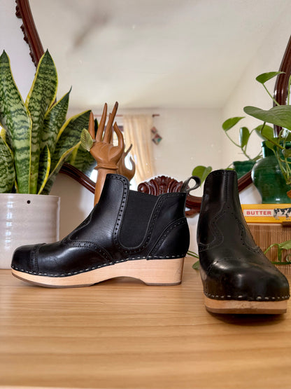 Black leather Swedish Haskbeen bottles with tooled leather detailing