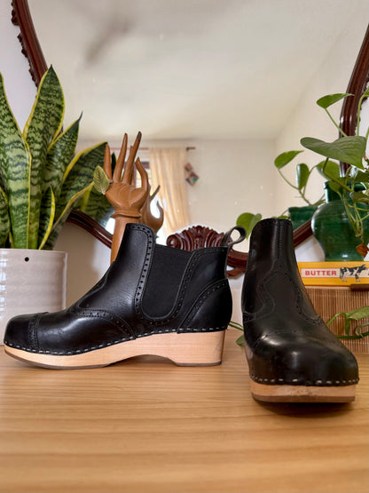 Black leather Swedish Haskbeen bottles with tooled leather detailing