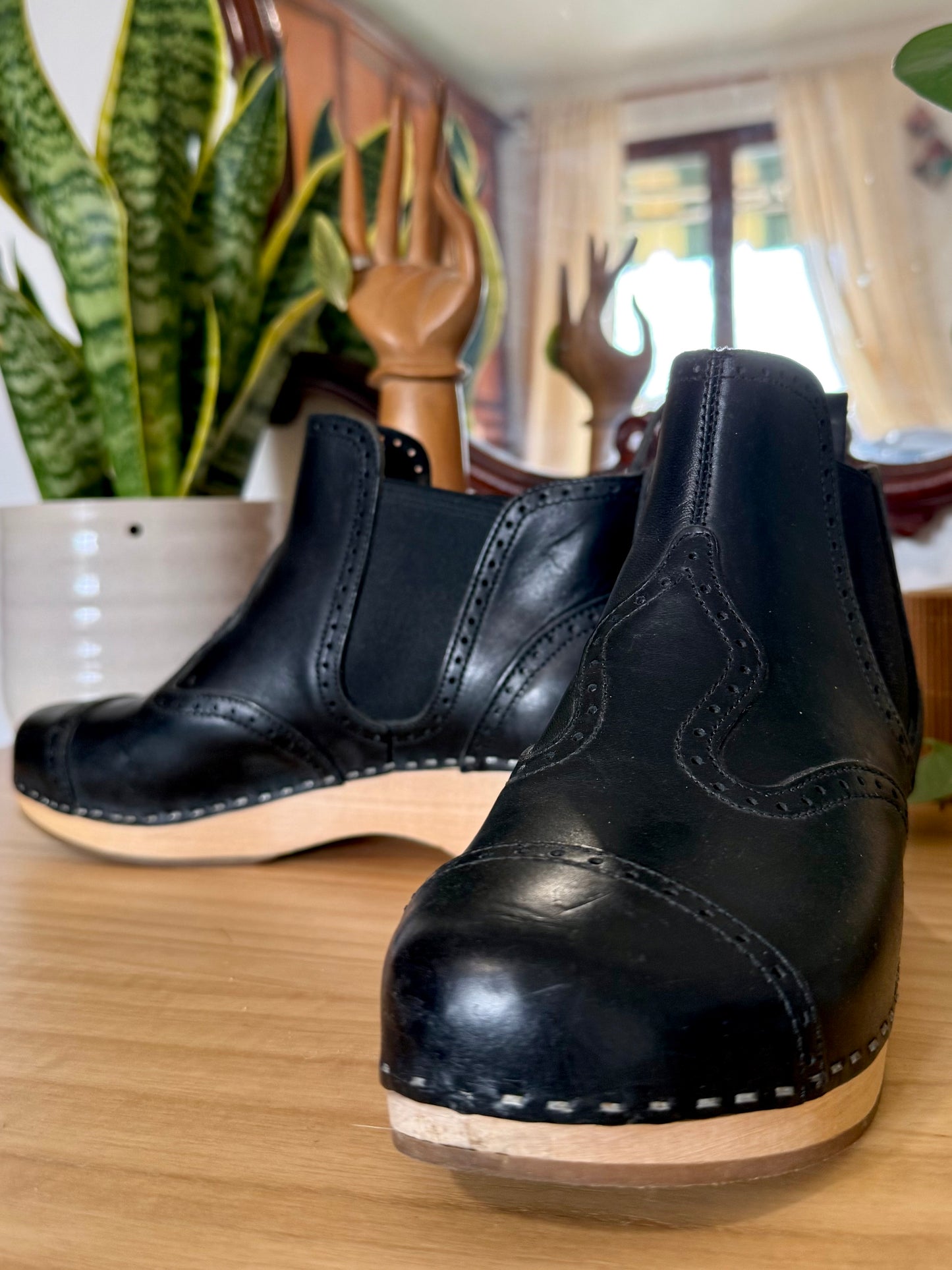 Black leather Swedish Haskbeen bottles with tooled leather detailing
