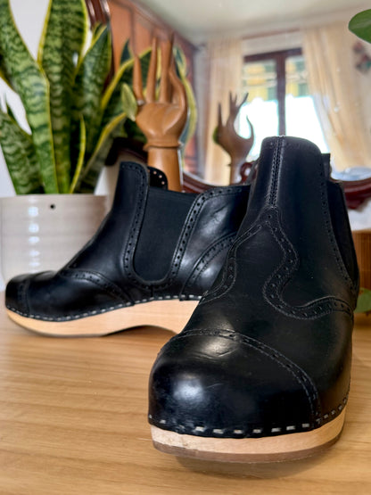 Black leather Swedish Haskbeen bottles with tooled leather detailing