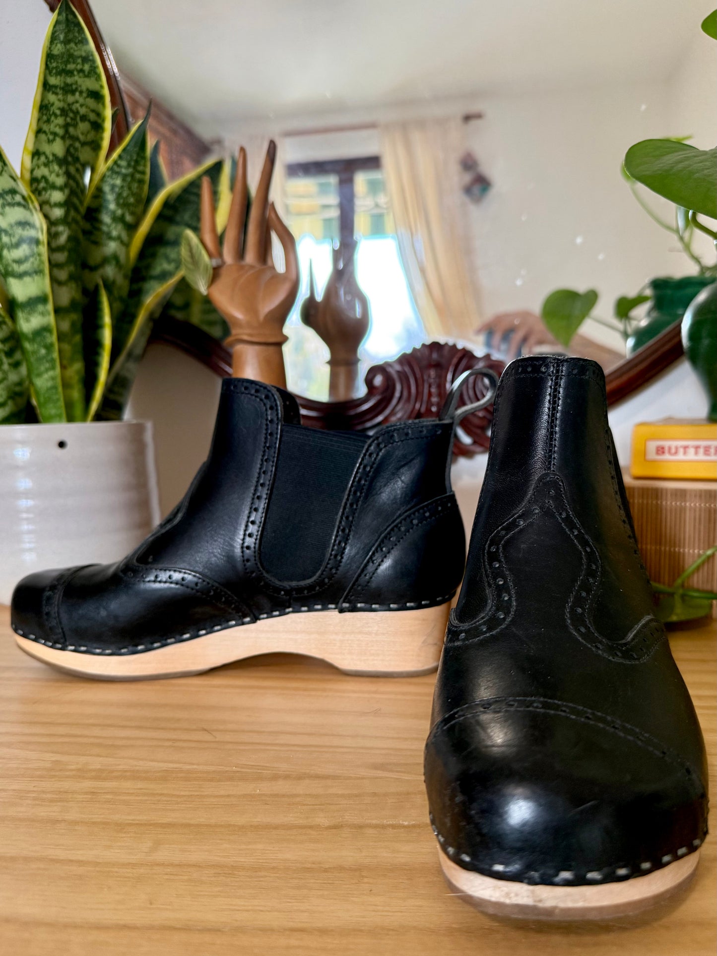 Black leather Swedish Haskbeen bottles with tooled leather detailing