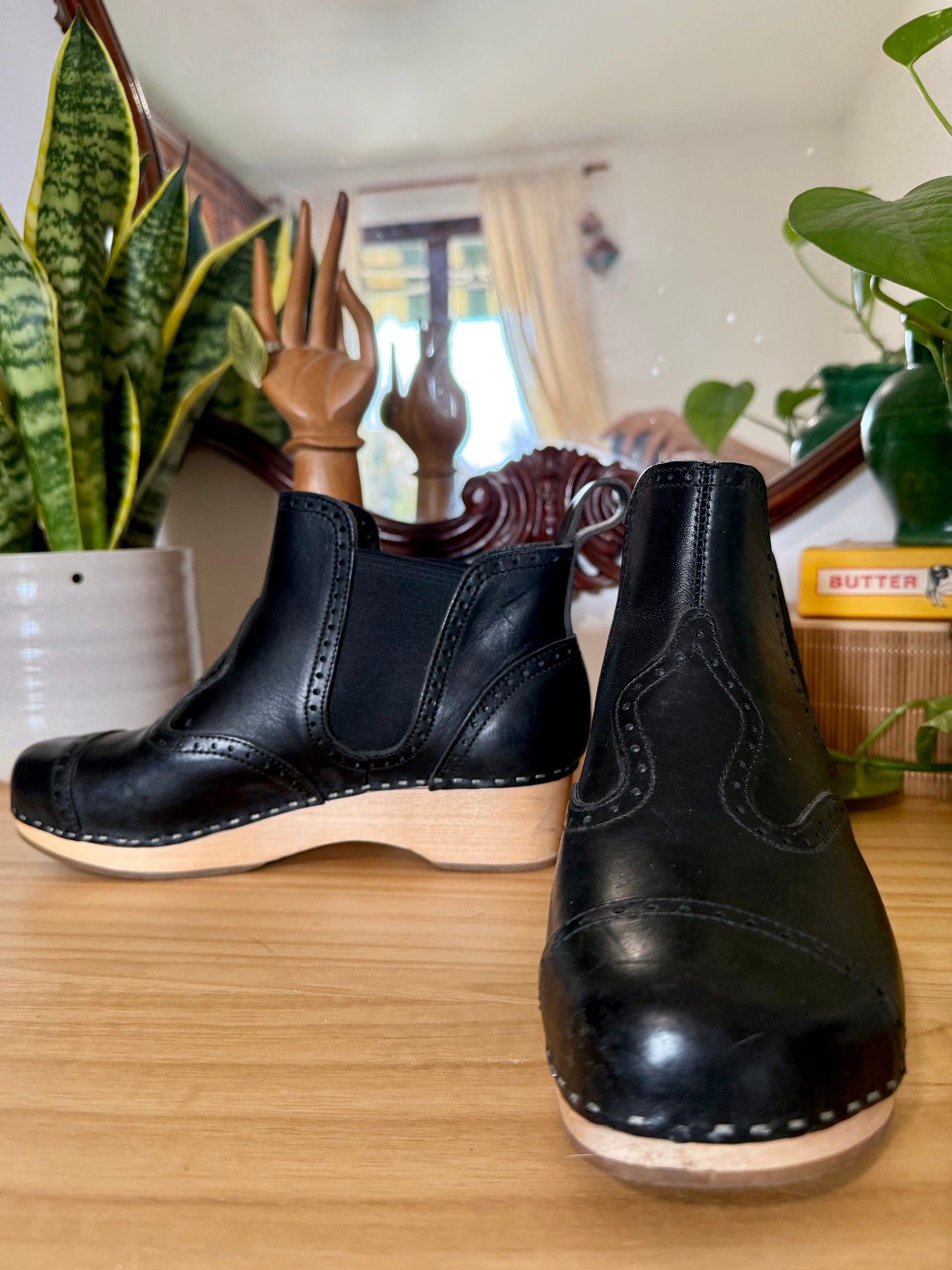 Black leather Swedish Haskbeen bottles with tooled leather detailing